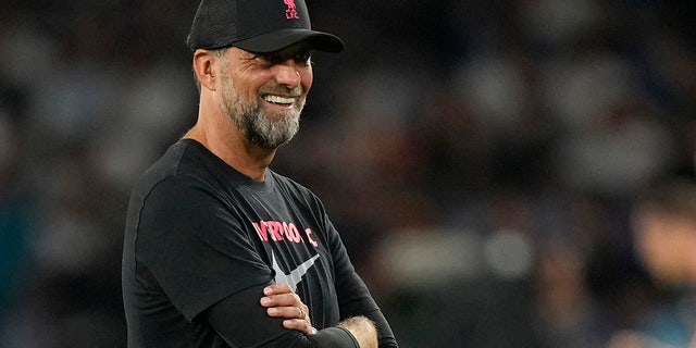 Liverpool's manager Jurgen Klopp smiles during his team's warm up before the group A Champions League soccer match between Napoli and Liverpool at the Diego Armando Maradona stadium in Naples, Italy, Wednesday, Sept. 7, 2022.