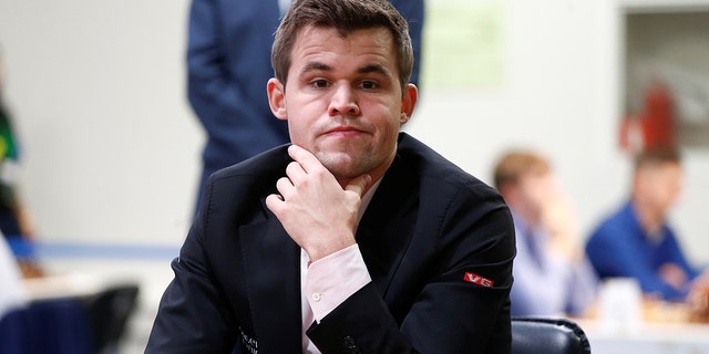 Magnus Carlsen of Norway plays against Adam Tukhaev of Ukraine. 