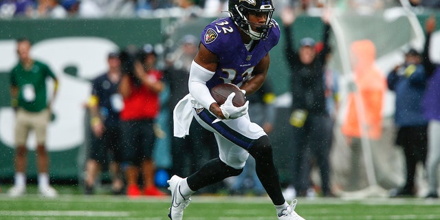 Baltimore Ravens' Marcus Williams (32) runs back an interception during the first half against the New York Jets in East Rutherford, New Jersey, on Sept. 11, 2022.