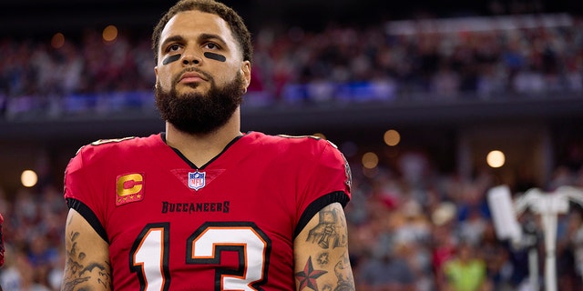 Mike Evans, #13 of the Tampa Bay Buccaneers, looks on before kickoff against the Dallas Cowboys at AT&amp;T Stadium on Sept. 11, 2022 in Arlington, Texas.