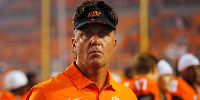 Head coach Mike Gundy of the Oklahoma State Cowboys looks around the field after his 150th career win at OSU with a victory against the Central Michigan Chippewas at Boone Pickens Stadium on Sept. 1, 2022 in Stillwater, Oklahoma.