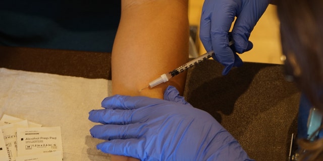 A medical worker administers a dose of the monkeypox vaccine in Los Angeles County, California, on Aug. 25, 2022.