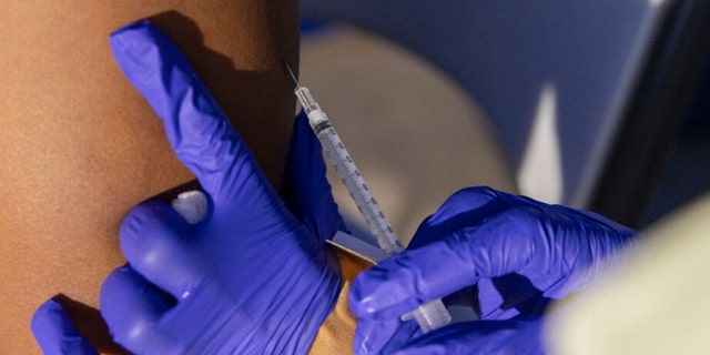 A physical assistant administers the monkeypox vaccine at a vaccinations site on Tuesday, Aug. 30, 2022, in the Brooklyn borough of New York. 