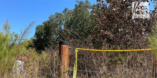 A police line near where the remains of missing teens Lyric Woods and Devin Clark were found Saturday