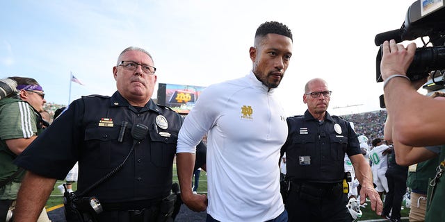 Head coach Marcus Freeman of the Notre Dame Fighting Irish walks off the field after losing to the Marshall Thundering Herd 26-21 at Notre Dame Stadium on September 10, 2022 in South Bend, Indiana.