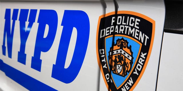 NYPD (New York Police Department) sign with logo.