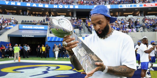 Odell Beckham Jr. holds the Super Bowl LVI trophy before the game between the Los Angeles Rams and Buffalo Bills at SoFi Stadium in Inglewood, California, on Sept. 8, 2022.