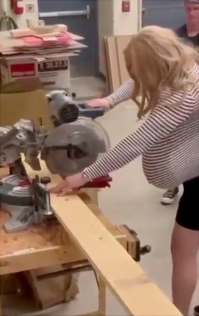 Transgender high school teacher works a saw in now-viral video.