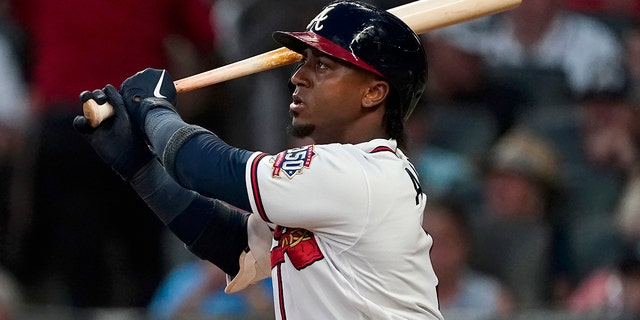 Atlanta Braves' Ozzie Albies watches his three-run home run during the fifth inning of the team's baseball game against the New York Mets on  Tuesday, June 29, 2021 in Atlanta.