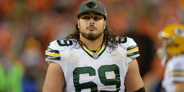 Nov 1, 2015; Denver, CO, USA; Green Bay Packers tackle David Bakhtiari (69) walks the sidelines late in the fourth quarter against the Denver Broncos at Sports Authority Field at Mile High. The Broncos defeated the Packer 29-10.