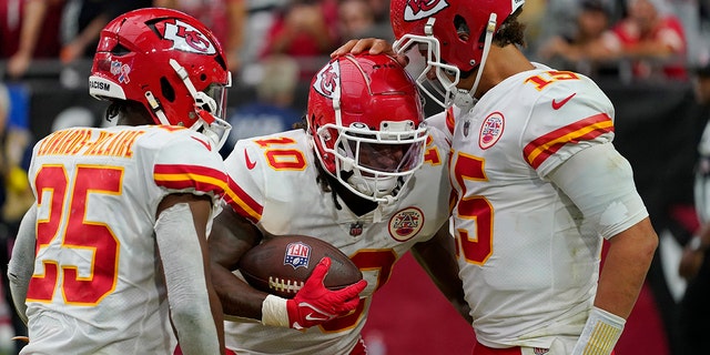 Kansas City Chiefs quarterback Patrick Mahomes, right, celebrates after running back Isiah Pacheco (10) scored a touchdown against the Arizona Cardinals Sept. 11, 2022, in Glendale, Ariz.