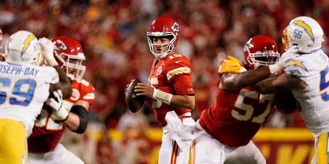 Kansas City Chiefs quarterback Patrick Mahomes drops back to pass during the first half of a game against the Los Angeles Chargers Thursday, Sept. 15, 2022, in Kansas City, Mo.