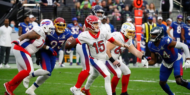 Kansas City Chiefs quarterback Patrick Mahomes, #15, attempts to pass the ball the NFL Pro Bowl presented by Verizon on Feb. 6, 2022 at Allegiant Stadium in Las Vegas. 