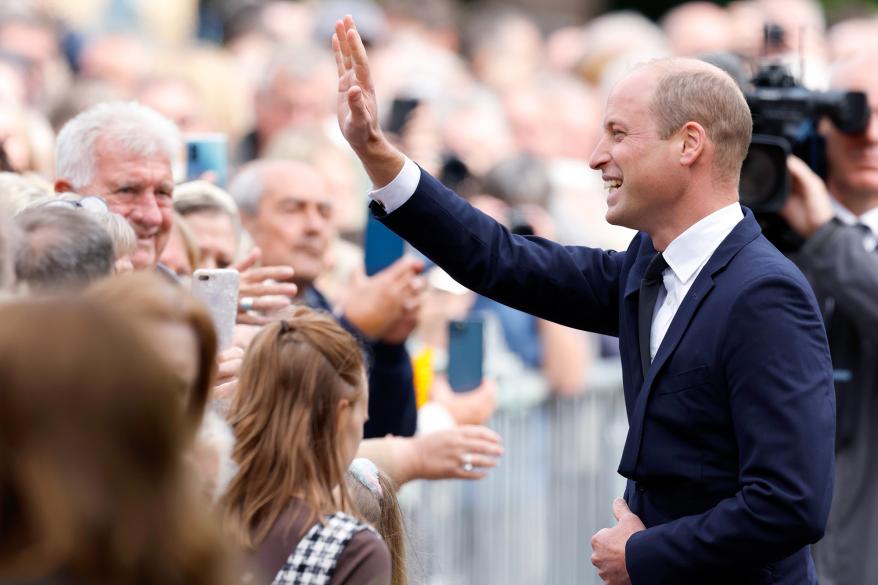 The Prince of Wales greets well-wishers on Thursday.