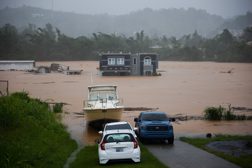 A home is submerged in floodwaters caused by Hurricane Fiona in Cayey, Puerto Rico on Sept. 18, 2022.  