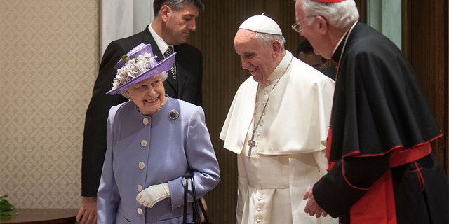 Queen Elizabeth II meets Pope Francis and Former Archbishop of Westminster Cardinal Cormack Murphy O'Connor, right, at the Paul VI Hall on April 3, 2014 in Vatican City, Vatican. (Photo by Vatican Pool/Getty Images)