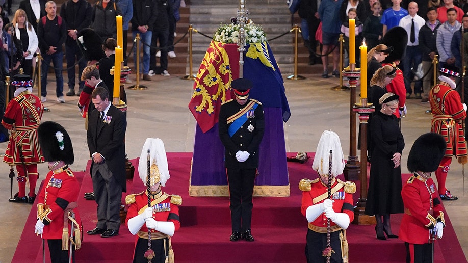 Queen Elizabeth II's grandchildren, including Prince William and Prince Harry, stand vigil