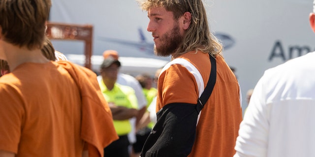 Texas quarterback Quinn Ewers leaves the field with his injured left arm in a sling after an NCAA college football game against Alabama, Saturday, Sept. 10, 2022, in Austin, Texas. Alabama won 20-19.