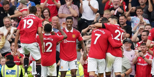 Manchester United celebrate after scoring their second goal against Arsenal at Manchester, England, Sunday, Sept. 4, 2022.