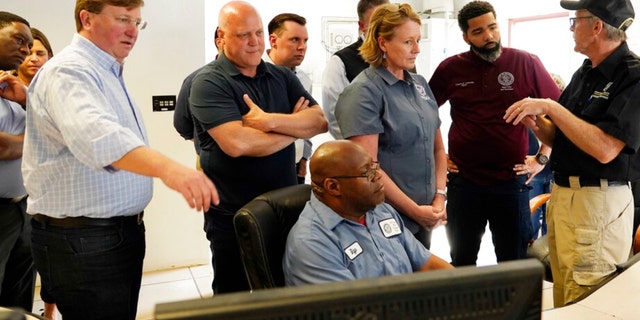 Jim Craig, with the Mississippi State Department of Health, right, explains the purpose of some of the monitors to Jackson Mayor Chokwe Antar Lumumba, second from right, Deanne Criswell, administrator of the Federal Emergency Management Agency, center, White House Infrastructure Coordinator Mitch Landrieu, second from left, and Mississippi Gov. Tate Reeves, left, during a visit to the City of Jackson's O.B. Curtis Water Treatment Facility in Ridgeland, Miss., Friday, Sept. 2, 2022. 