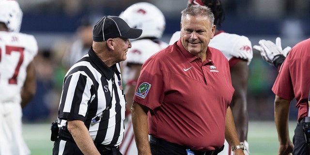 Arkansas coach Sam Pittman talks with an official on Saturday, Sept. 24, 2022, in Arlington, Texas.