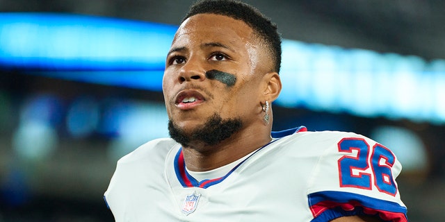 Saquon Barkley of the New York Giants warms up before kickoff against the Dallas Cowboys at MetLife Stadium Sept. 26, 2022, in East Rutherford, N.J.