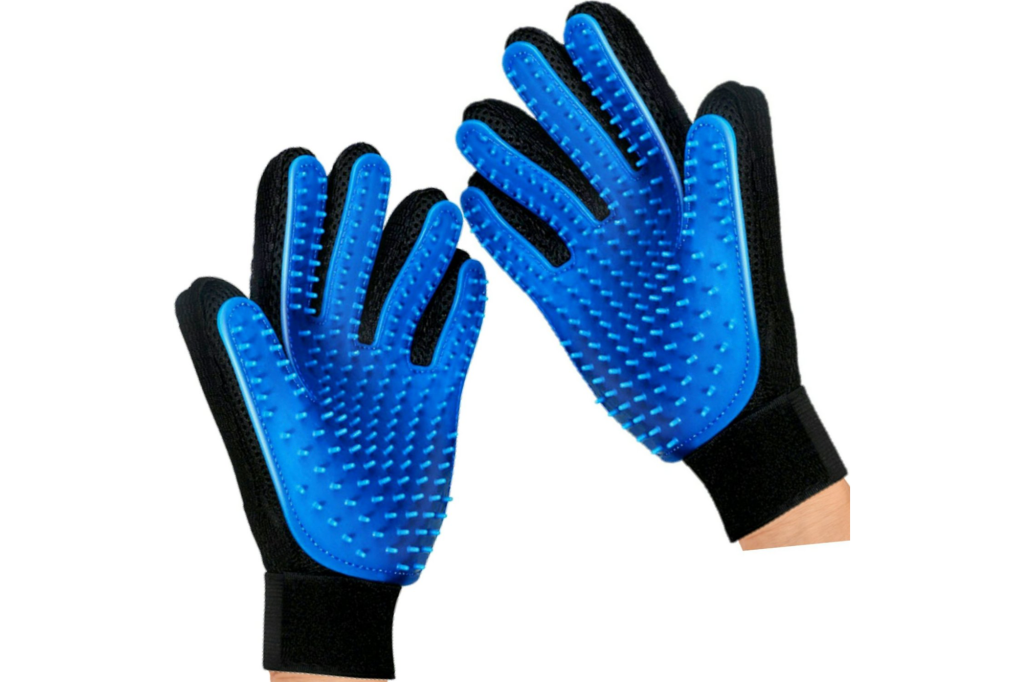 A pair of gloves with blue rubber spikes for pet grooming 