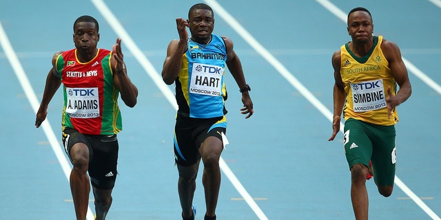 Antoine Adams, of Saint Kitts and Nevis, Shavez Hart, of the Bahamas, and Akani Simbine, of South Africa, compete in the Men's 100-meter heats during Day One of the 14th IAAF World Athletics Championships Moscow 2013 at Luzhniki Stadium on August 10, 2013, in Moscow.