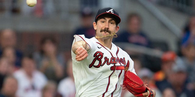 Atlanta Braves starting pitcher Spencer Strider throws to first base in the fourth inning of a baseball game against the Houston Astros Saturday, Aug. 20, 2022, in Atlanta.