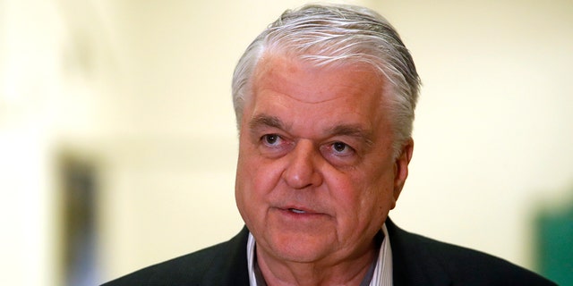 In this Tuesday, March 17, 2020 photo, Democrat Nevada Gov. Steve Sisolak speaks during a news conference at the Sawyer State Building in Las Vegas.