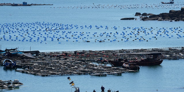 A boat moves through the water at the 68-nautical-mile scenic spot, the closest point in mainland China to the island of Taiwan, in Pingtan in southeastern China's Fujian Province, Friday, Aug. 5, 2022.