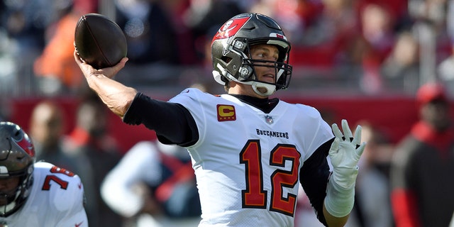 Tampa Bay Buccaneers quarterback Tom Brady (12) throws a pass during the first half of an NFL divisional round playoff football game against the Los Angeles Rams Sunday, Jan. 23, 2022, in Tampa, Fla.