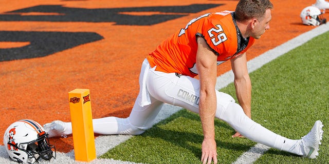 Punter Tom Hutton of the Oklahoma State Cowboys stretches before a game against the Tulsa Golden Hurricanes Sept. 19, 2020, at Boone Pickens Stadium in Stillwater, Okla.