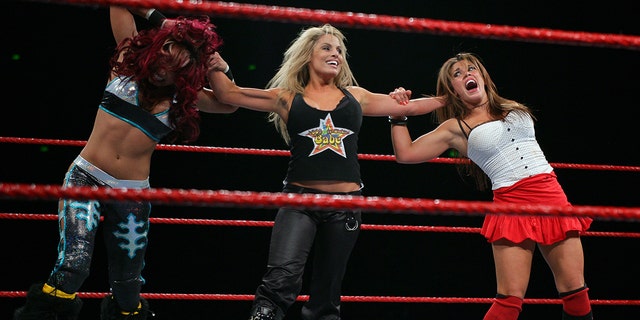 Trish Stratus seems to have control over both Melina and Mickey James during the WWE RAW Superslam event at Acer Arena, Homebush Stadium on August 4, 2006. 