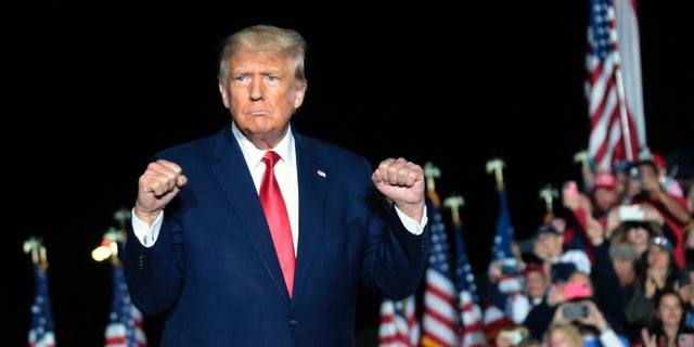 Former President Donald Trump gestures as he holds a rally Friday, Sept. 23, 2022, in Wilmington, N.C. (AP Photo/Chris Seward)