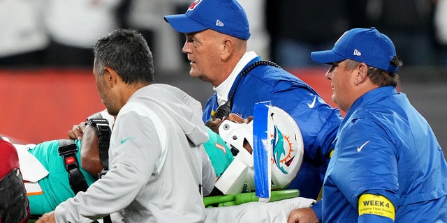 Sep 29, 2022; Cincinnati, Ohio, USA; Miami Dolphins quarterback Tua Tagovailoa (1) is taken off the field after suffering a head injury following a sack by Cincinnati Bengals defensive tackle Josh Tupou (not pictured) in the second quarter at Paycor Stadium in Cincinnati.