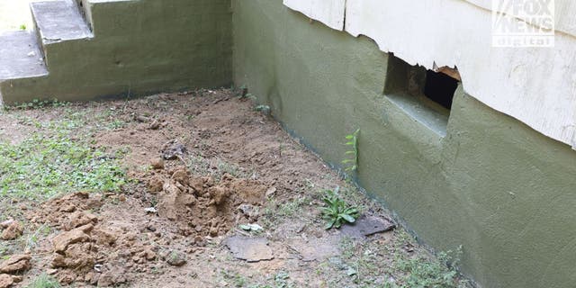 The side of crawl space of house where the body of Eliza Fletcher was found