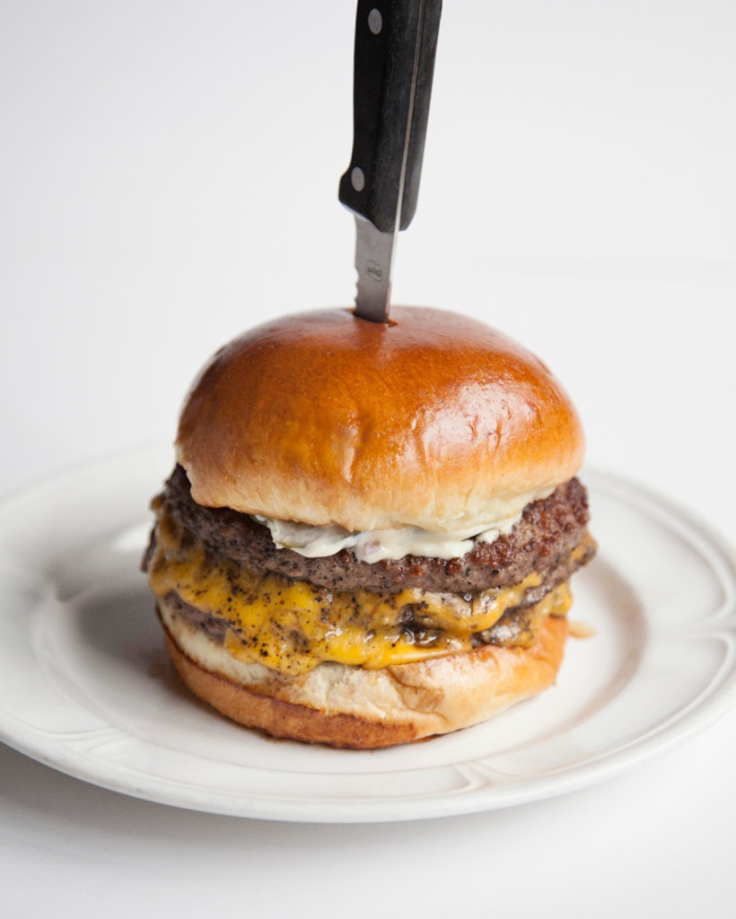 Chicago's famous Au Cheval burger makes its Midtown debut at the revamped Monkey Bar.