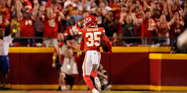 Kansas City Chiefs cornerback Jaylen Watson runs an interception back for a touchdown during the second half of an NFL football game against the Los Angeles Chargers Thursday, Sept. 15, 2022, in Kansas City, Mo.