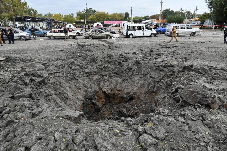 The Russian missile strike left a crater in the road in Zaporizhzhia, Ukraine on Sept. 30, 2022.