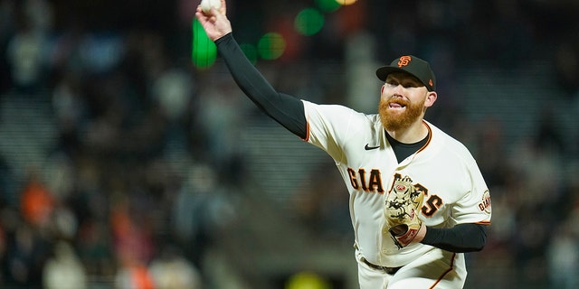 San Francisco Giants' Zack Littell pitches against the Atlanta Braves during the eighth inning of a baseball game in San Francisco, Monday, Sept. 12, 2022.