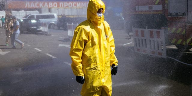 A Ukrainian Emergency Ministry rescuer attends an exercise in the city of Zaporizhzhia on August 17, 2022, in case of a possible nuclear incident at the nuclear power plant located near the city.