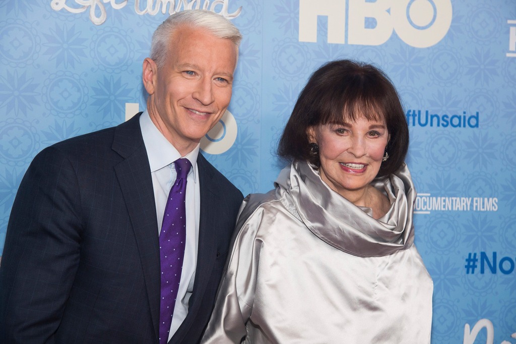  CNN anchor Anderson Cooper and Gloria Vanderbilt attend the premiere of "Nothing Left Unsaid" at the Time Warner Center in New York. Vanderbilt, the "poor little rich girl" heiress at the center of a scandalous custody battle of the 1930s and the designer jeans queen of the 1970s and '80s, died on Monday, June 17, 2019, at 95, according to her son, Cooper. (Photo by Charles Sykes/Invision/AP, File)