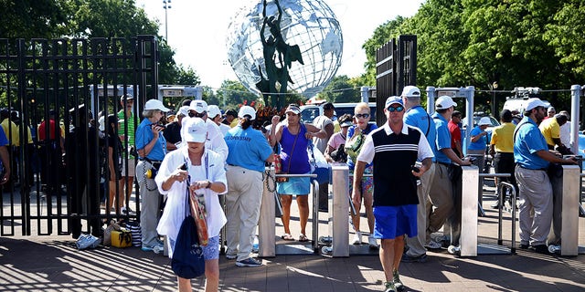 Fans gather outside of security to enter the venue on Day Two of the 2016 US Open at the USTA Billie Jean King National Tennis Center on August 30, 2016, in the Flushing neighborhood of the Queens borough of New York City. 
