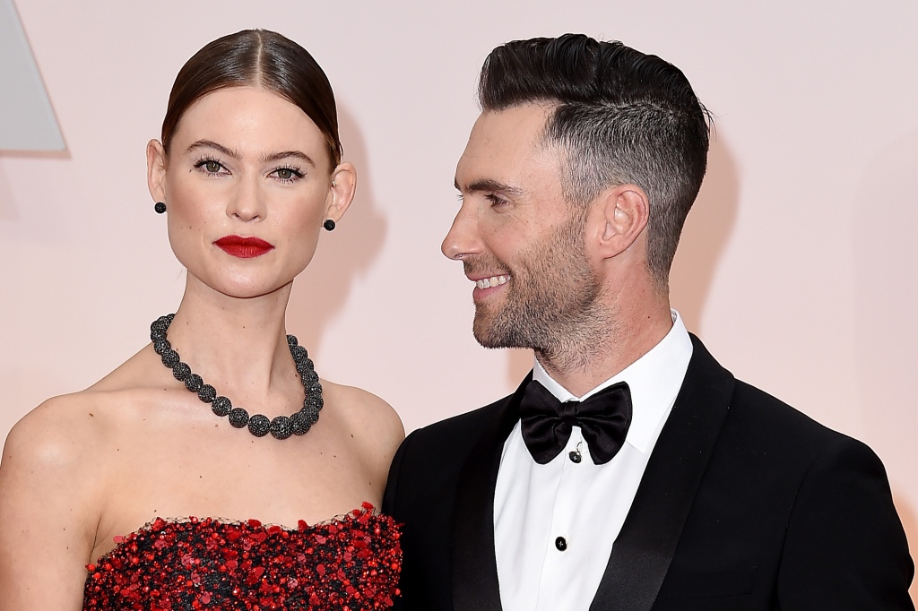 Singer Adam Levine (R) and Behati Prinsloo attend the 87th Annual Academy Awards at Hollywood & Highland Center on February 22, 2015 in Hollywood, California.  