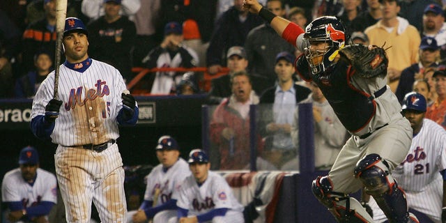 Catcher Yadier Molina of the St. Louis Cardinals reacts after Carlos Beltran (15) of the New York Mets strikes out to end Game 7 of the NLCS at Shea Stadium Oct. 19, 2006, in the Flushing neighborhood of the Queens borough of New York City. The Cardinals won 3-1.