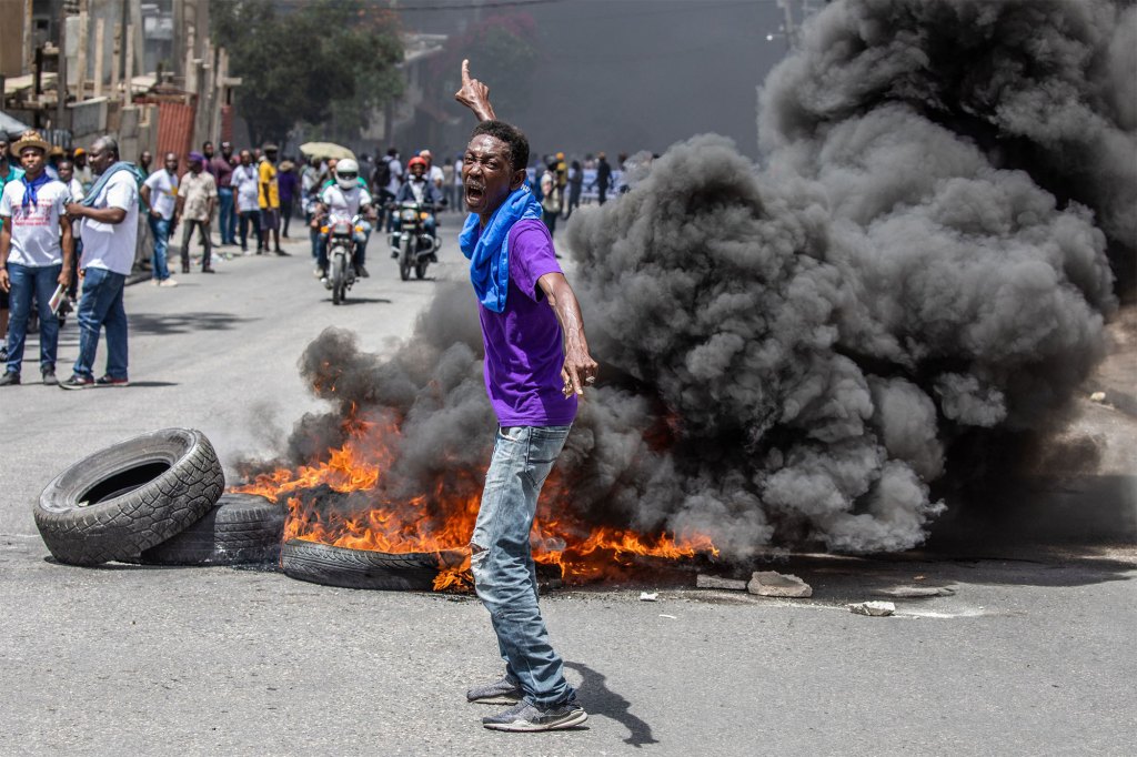 Haitians take to the streets to protest over the increasing insecurity in the Haitian capital Port-au-Prince, on March 29, 2022.