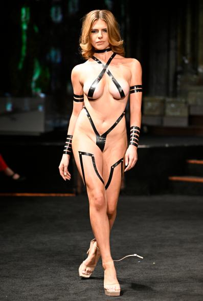A model walks the runway in her NSFW couture.