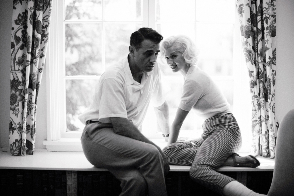 Joe DiMaggio, referred to as the Ex-Athlete (Bobby Cannavale), beats Marilyn when he sees the poster for "The Seven Year Itch." 