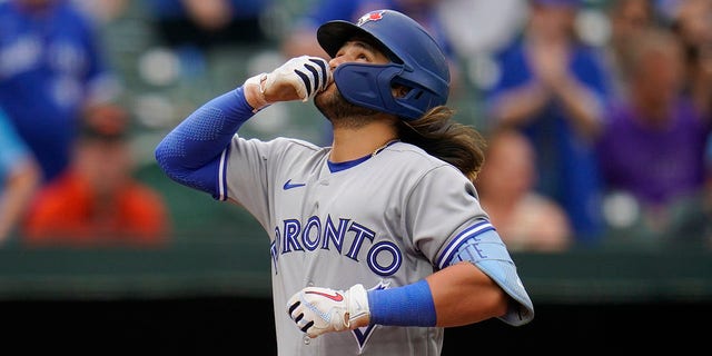 Toronto Blue Jays' Bo Bichette reacts after hitting a three-run home run off Baltimore Orioles relief pitcher Nick Vespi during the third inning of the second game of a baseball doubleheader, Monday, Sept. 5, 2022, in Baltimore. Blue Jays' Jackie Bradley Jr. and George Springer scored on the home run.